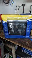 Photo of boxed Gravity Feed Spray Gun Kit showing front window with three spray guns.