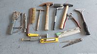 Full view of all tiling and hand tools included in the lot, showing variety of items and general condition