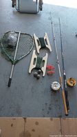 Overview of fishing gear including rods, reels, nets, bobbins, weights and accessories