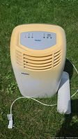 Front view of Haier portable air conditioner showing control panel, vents, and power cord.