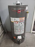 Front full-height view showing tank, control module and warning labels