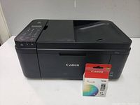 Front angled view of black Canon PIXMA all-in-one printer with Canon PG-41 ink cartridge in front.
