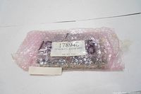 Mitutoyo electronic plate circuit board in original pink anti-static bubble wrap packaging, label showing part number 17894 and model 17894D G-PIB RD. BOARD ASSY.