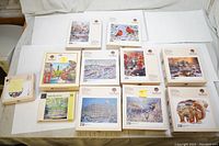 Photo of 11 Wentworth wooden puzzle boxes, featuring nature and cityscape images, mostly 250 piece puzzles with one 80 piece puzzle box