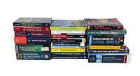 Photo of the entire lot with spines visible showing titles of engineering books stacked in three rows.
