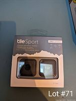 Photo showing Tile Sport Pro Series keychain finders 2-pack in original packaging with black and white Tile devices visible.