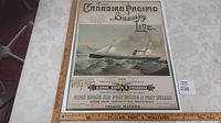 Photo showing entire poster including text and artwork of the Canadian Pacific Steamship Line Inland Waters steamship Algoma with ruler for scale.