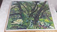 Framed oil painting depicting a green forest scene with prominent tree trunks and dense foliage.
