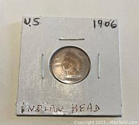 Photo of the obverse of the 1906 Indian Head penny in holder showing Lady Liberty profile.