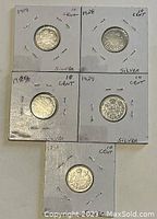 Five Canadian silver 10 cent coins from 1919, 1928, 1929 (two coins), and 1931.