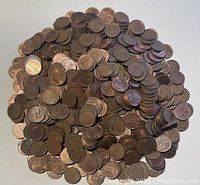 Large pile of vintage Canadian pennies in varied condition