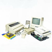 Full view of all items in the lot including the Macintosh Plus computer, ImageWriter printer, external floppy drive, mouse, cables, manuals, and software disks.
