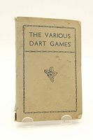 Front cover of 'The Various Dart Games' book showing title, graphic and wear.