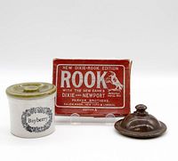 Photo showing ceramic Bayberry jar with lid, brown ceramic lid, and unopened Rook card game box.