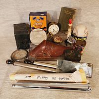 Photo showing entire lot with vintage fishing gear, baseball, clock, and other collectibles