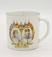 Front side showing portraits of Queen Mary and King George V with inscriptions and crowns
