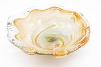 Top view of the Murano glass dish showing the scalloped rim and swirl color pattern
