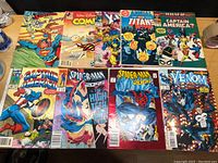 Full lot of 10 comic books laid out on a table showing front covers