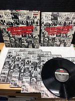 Photo showing all four records with their sleeves and the outer box cover, featuring vintage photos and text from The Rolling Stones' early singles in London.