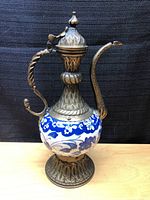 Full view of the Turkish porcelain and brass ewer pitcher showing body, handle, spout, and lid details.