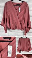 Front view of pink mauve New York & Co top on hanger showing frill detail on sleeves and elastic hem.