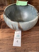 Full view of Blue Mountain Pottery bowl showing exterior glaze colors and design.