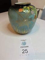 Front and partial side view of the Carltonware vase showing floral and spider web design with a maxsold auction tag showing dimensions 6" diameter by 6" height.