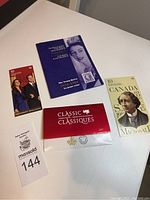 Lot showcasing all items together on white surface: 2017 Canadian Classic Coin Set envelope, Queen Elizabeth II Jubilee stamp booklet, Sir John A. Macdonald stamp booklet, and small stamp sheet with Prince William and Kate Middleton.