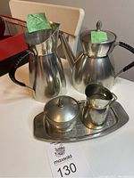 Full view of the set: teapot, coffee pot, sugar bowl, creamer on tray.