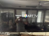 Samsung Smart TV powered on showing startup screen
