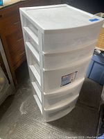 White Sterilite 5 drawer tower storage unit in plastic, showing five drawers and overall shape.