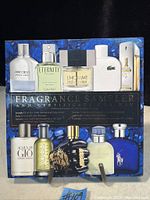 Photo of the fragrance sampler set box showing full-color images of the 10 featured gentlemen's fragrances