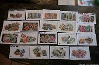 Overview of 19 stock cards with used Italy stamps arranged on table showing variety of stamps