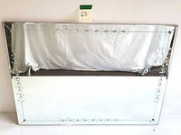 Full view of rectangular wall mirror showing the clear reflective surface and etched border pattern.