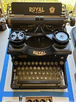 Front view showing keyboard, ribbon spools and platen carriage