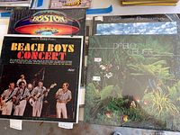 Four vinyl album covers: Boston – Boston; The Beach Boys – Concert; Jackson Browne – Jackson Browne; Pablo Cruise – Pablo Cruise
