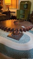 Full view of the cog-shaped table in a room setting
