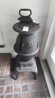 Full view of cast iron stove with flat iron on top