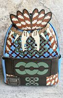 Front view of the backpack showing Black Panther Wakanda Forever themed design with feather accents on top and Marvel Loungefly branding