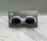 Front of Disney swim goggles package, showing goggles in mint condition, with tinted lenses and colorful accents.