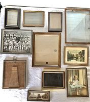 Overview of 11 wooden photo frames in various styles and sizes, some containing vintage photos or prints.