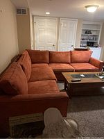 Overall assembled sectional sofa in basement setting