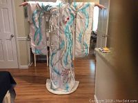 Full front view of kimono hanging with arms extended