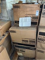 Stacked cartons labeled Carry-Safe M60-8000 with single tray displayed on top