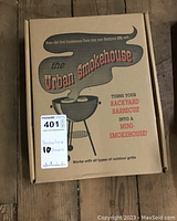 Closed box of Urban Smokehouse smoker showing brand and product claims on cover.