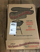 Closed Urban Smokehouse box showing branding and usage tagline.