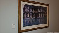 Full view of framed Claude Monet print depicting a Venetian canal with blue and purple color palette.