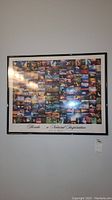 Full view of framed collage print on wall showing multiple colorful photographs of Florida nature and landscapes.