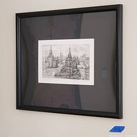 Framed pencil drawing of Russian architectural scene hung on wall, 18x22 inches, black frame and matting.
