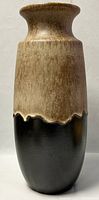 Front view of the vase showing flared rim, textured glaze transition from beige-brown to black.